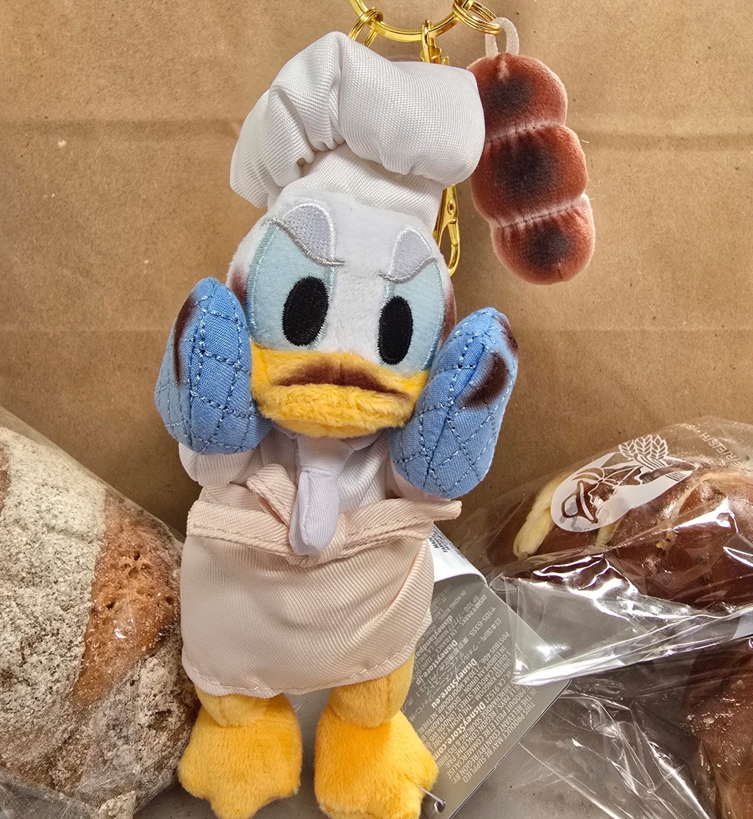 2026 Disney Parks Donald Duck Bakery Plush Keychain Holding Baguette 2026 Disney Parks Donald Duck Bakery Plush Keychain Holding Baguette